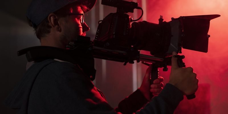 man-filming-with-professional-camera